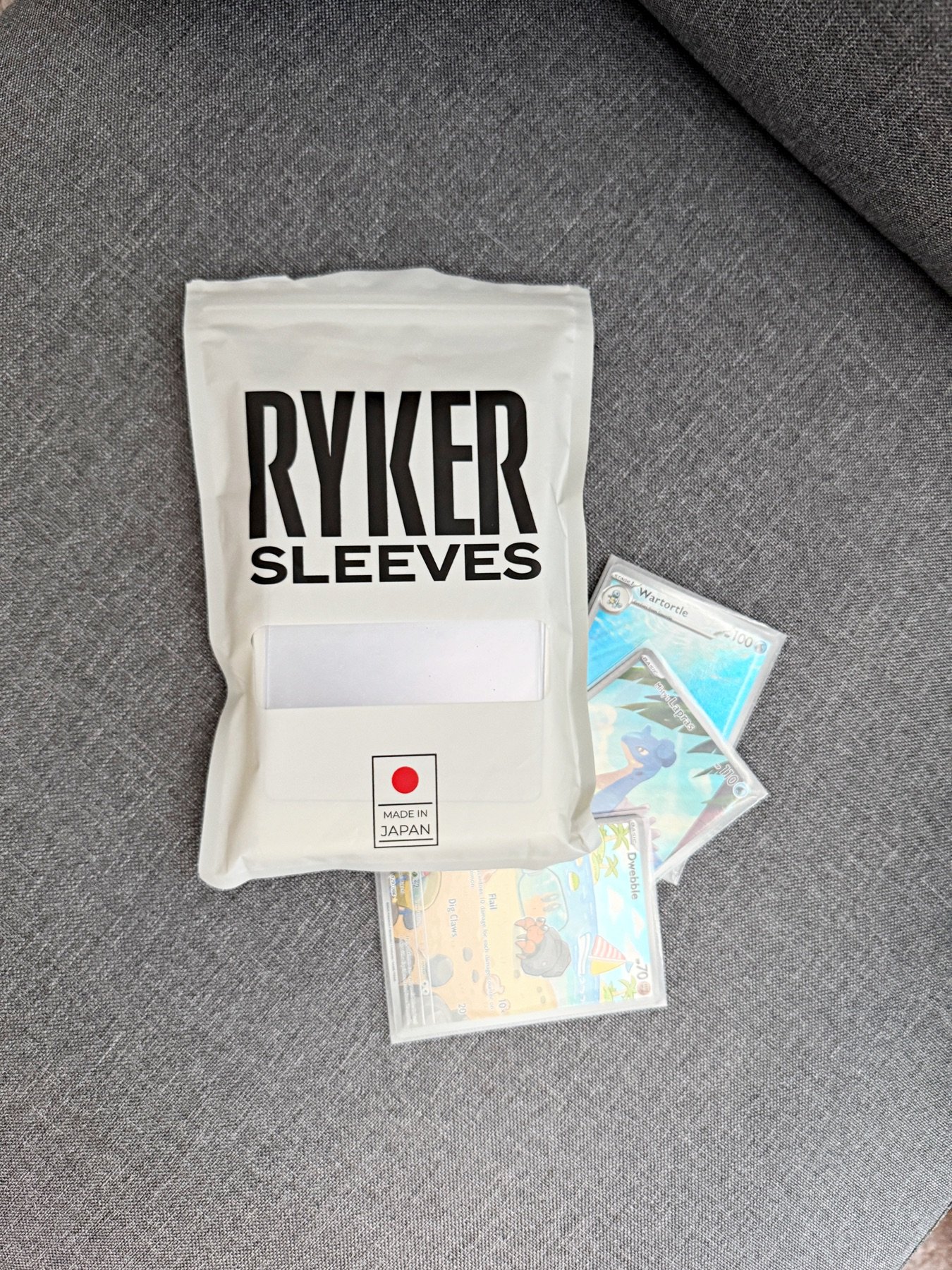 Rhyker card sleeves used before placing Pokémon cards in a binder