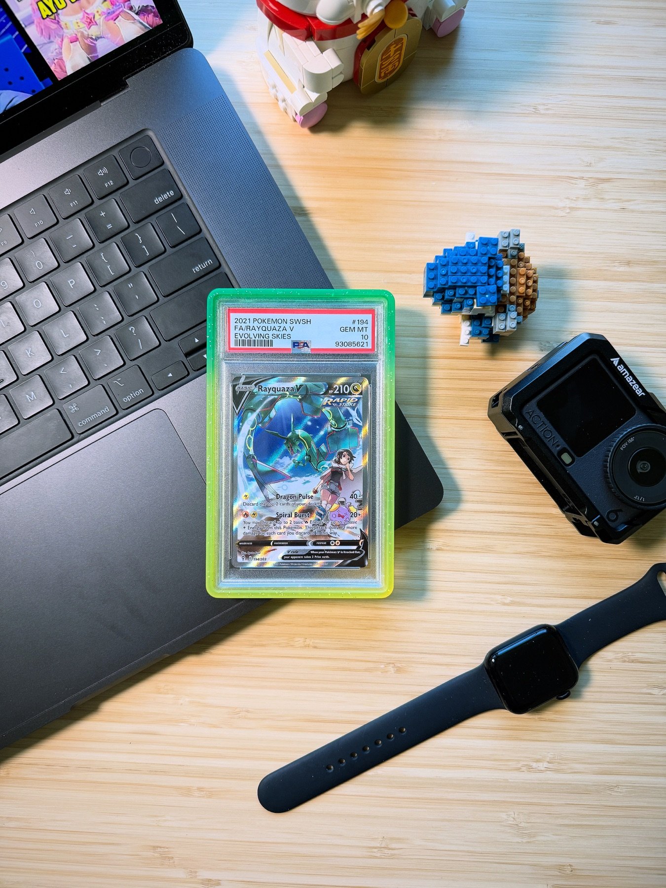 Color-matched Graded Guard protectors displayed around graded Pokémon card slabs